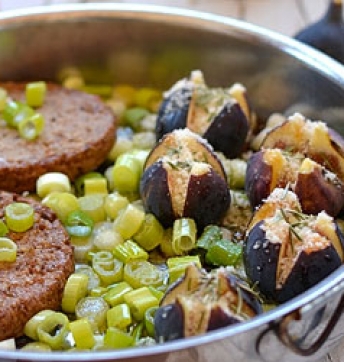 Soya steaks served on a bed of spring onions with grilled figs, Parmigiano Reggiano PDO and Balsamic Vinegar of Modena PGI