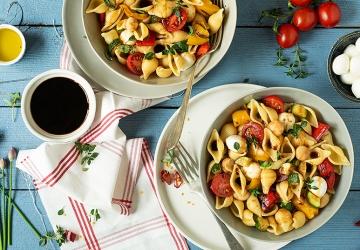 Pasta salad with vegetables and small mozzarella balls