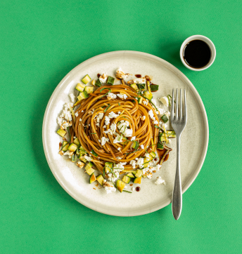 Spaghettini with courgettes, mint, lemon and feta cheese caramelised with Balsamic Vinegar of Modena PGI