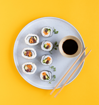 Rice sushi rolls with Balsamic Vinegar of Modena PGI, tuna and vegetables