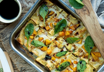 Cannelloni stuffed with ricotta cheese, spinach and mushrooms with diced pumpkin