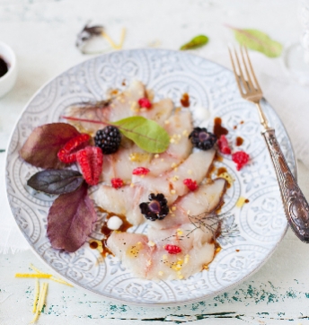 Raw amberjack with red fruits, herbs and Balsamic Vinegar of Modena PGI